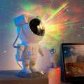 CJ Astronaut Galaxy Projector displaying starry sky and nebula light in a room, USB-powered night light with space-themed design