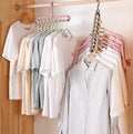 Plastic hanger storage organizer by cj, featuring a space-saving hook for efficient closet and wardrobe use.
