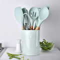 Silicone kitchenware with wooden handle by cj, featuring a vibrant color and ergonomic design for comfortable cooking.
