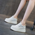 Women’s wedge platform sneakers by CJ, casual vulcanize shoes with thick soles and height-increasing design, shown on a clean background.