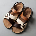 Men's simple hollow-out cork slippers by cj, flat summer sandals with open design and comfortable slip-on style.