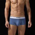 Men's breathable cotton boxers by CJ, low waist design with comfortable fit, shown in a relaxed, natural stance.
