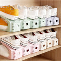 Plastic double shoe shelf cabinet by CJ, stackable shoe rack with adjustable compartments for organized footwear storage.