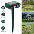 Solar-powered ultrasonic animal repeller by CJ with motion sensor, waterproof design, repels deer, raccoons, cats, and squirrels outdoors.