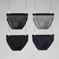 Men's triangle shorts by CJ in four gift boxes, featuring stylish designs and comfortable fit, displayed on a neutral background.