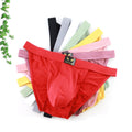Nylon men's underwear by CJ, solid color, mid-waist fit, breathable design, sexy triangle cut, displayed on a model.