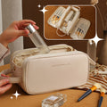 CJ 3-Layer U-Shape PU leather cosmetic bag with double zippers, large capacity, portable makeup and skincare organizer for women.
