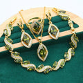 Hypoallergenic gold jewelry set with AAA zircon necklace, bracelet, earrings, and ring, featuring elegant and shiny design.