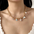 Nautical jewelry gift set featuring starfish and pearl necklace with matching bracelet, ideal for seaside-inspired accessories.