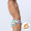 Men's low waist swim briefs by CJ with fruit print, quick-drying fabric, and built-in cup for comfortable beach or pool wear.