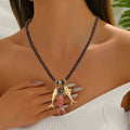 Vintage woven fish necklace with intricate artisan craftsmanship, featuring colorful woven details and a versatile fashion jewelry design.