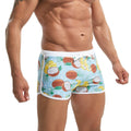 Men's nylon printing swim briefs by CJ, featuring vibrant summer design and snug fit for beach or poolside swimming.