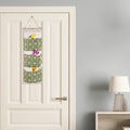CJ wall-mounted storage bag with three waterproof fabric pockets hanging on a door for closet organization.