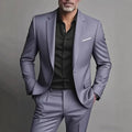 Men's slim fit 2-piece suit by cj, shown in a casual wedding and business setting, featuring a tailored jacket and matching trousers.