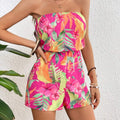 Colorful floral romper by cj, featuring a strapless design perfect for holidays and warm weather outings.